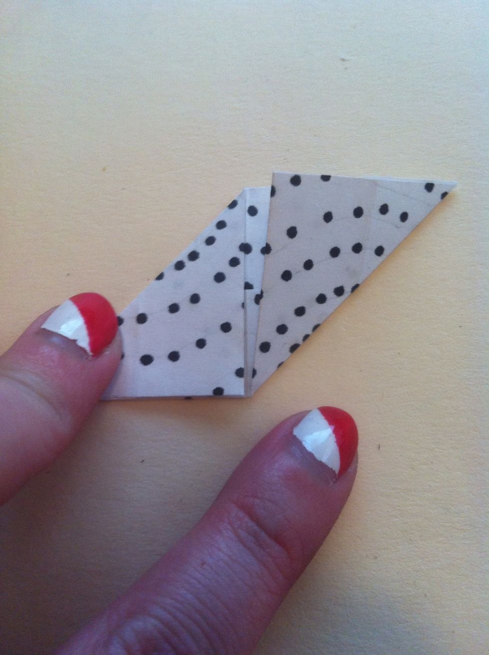 Now fold right bottom corner to top edge.