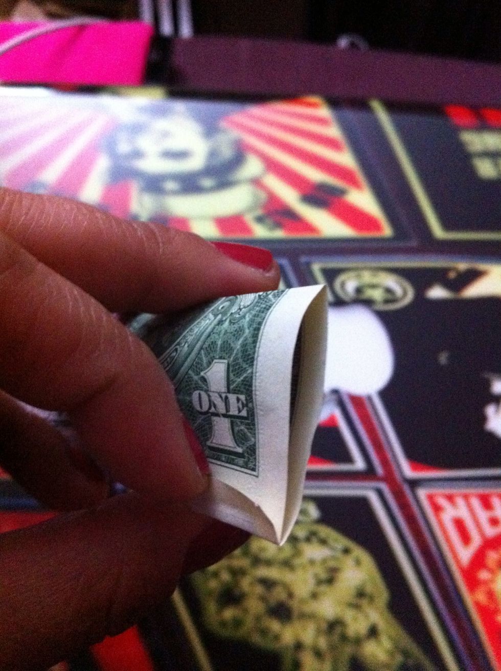 Now fold the bottom inside the little fold to look like this.