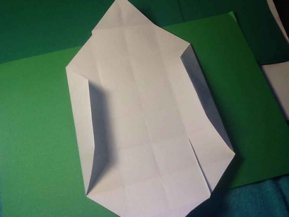 Now fold the corner and the fists set of squares down to the next line