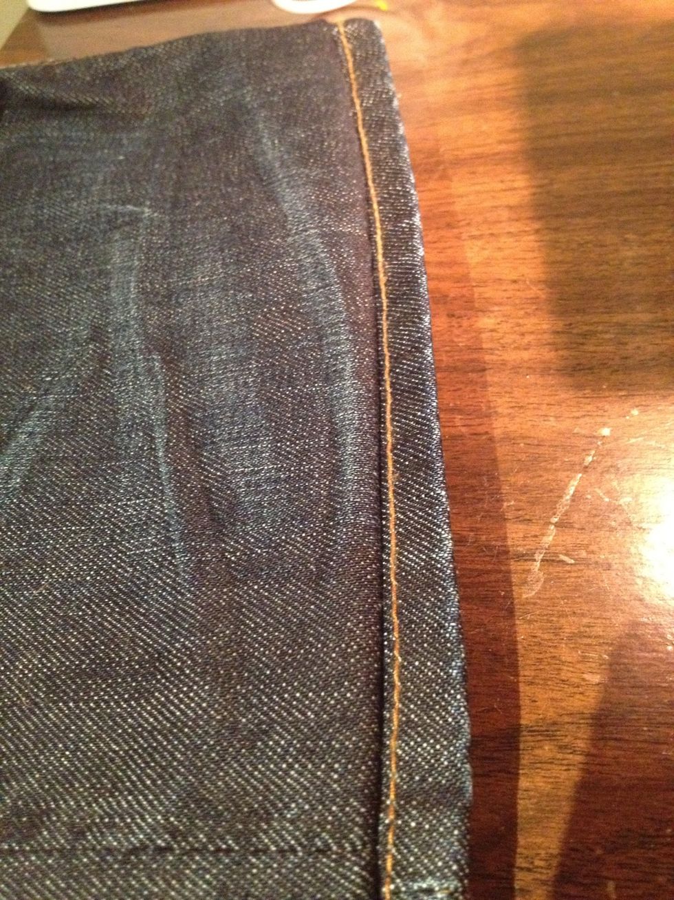 Now fold the jeans over--right side out! It's up to you whether you want to cut out the extra material on the underside or just iron it in really well.