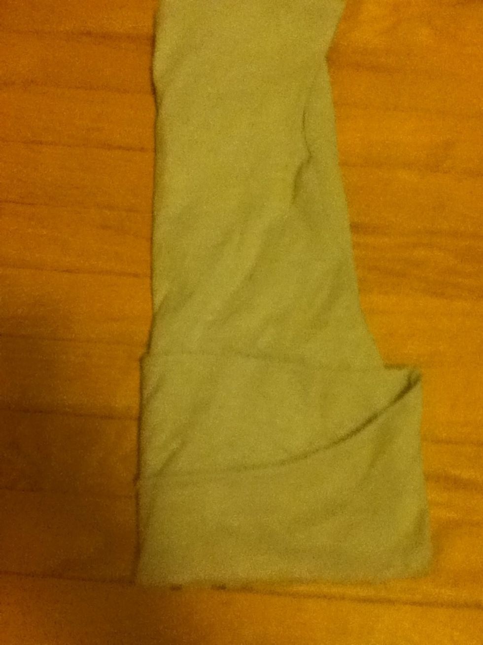 Now fold the left side to touch the fold on the right side.