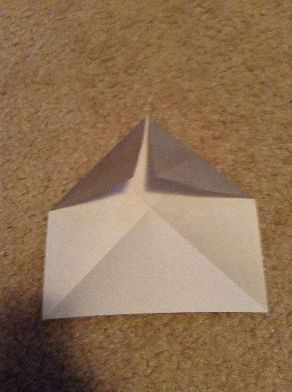 Now fold the other corner to the middle