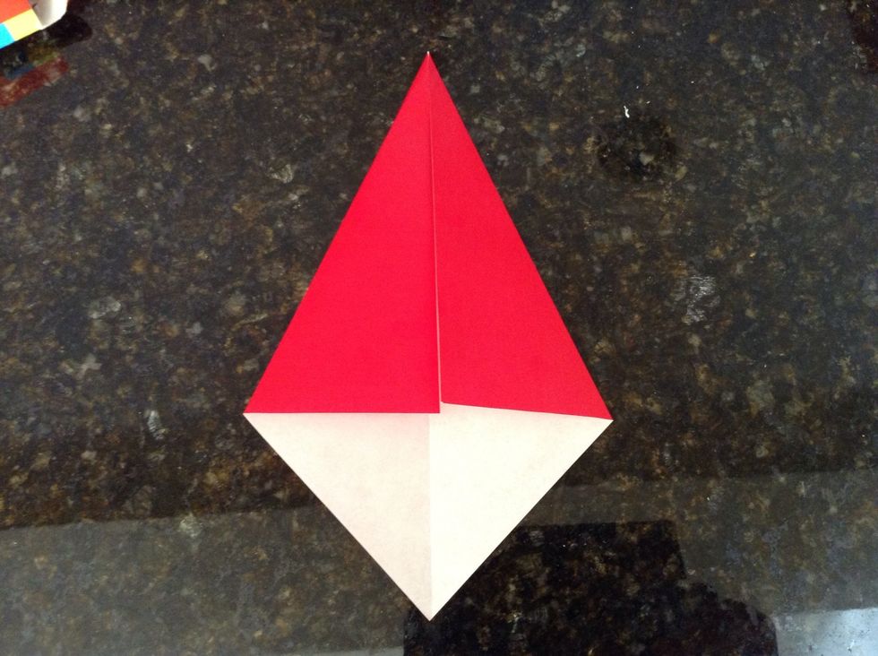 Now, fold the other top side edge and make it meet the center.