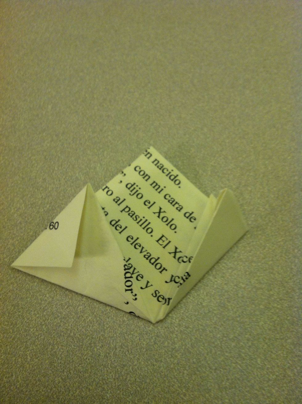 Now fold the right flap in half