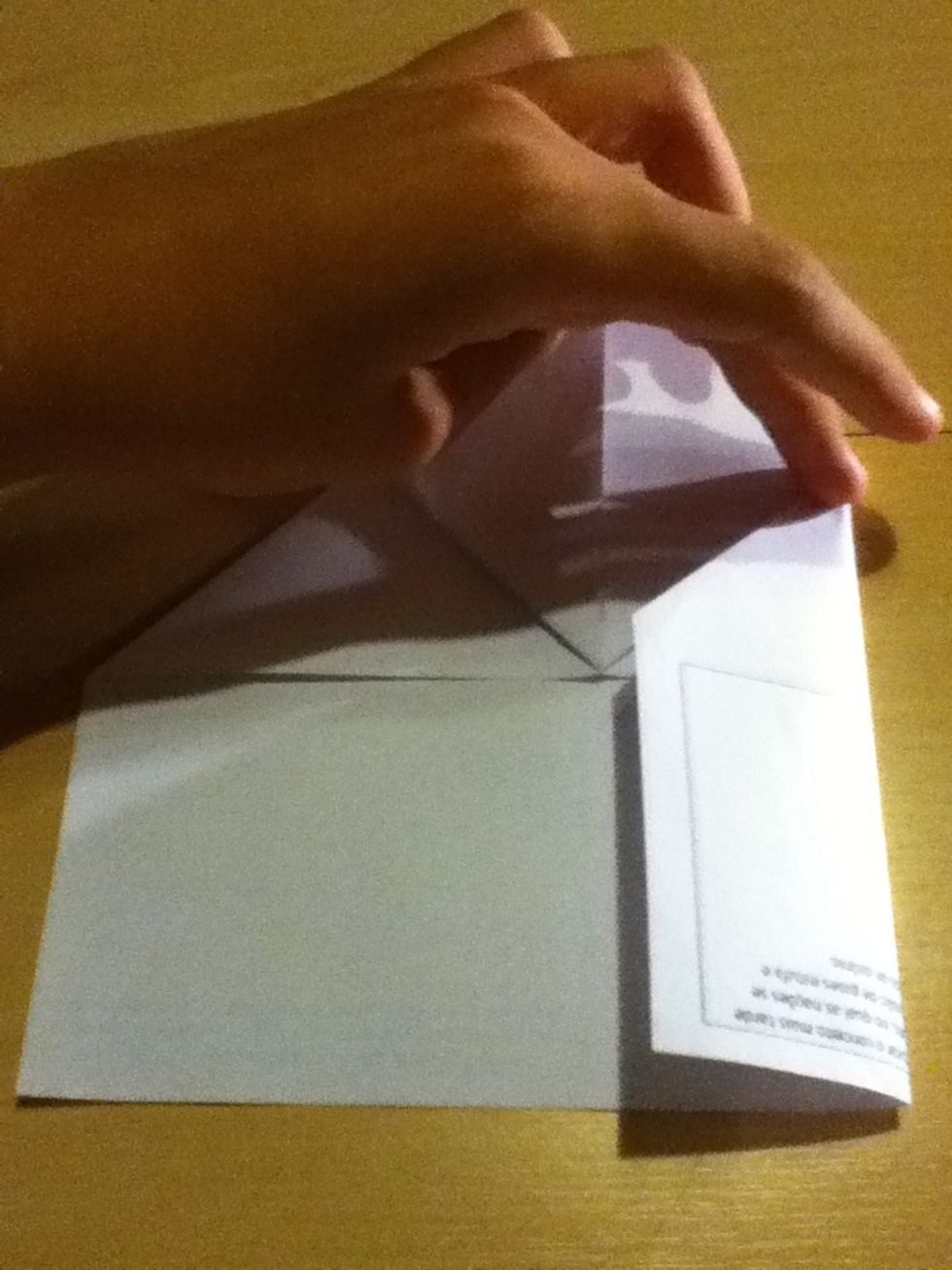 Now fold the sides of the sheet until they reach the center of it, just like in the picture
