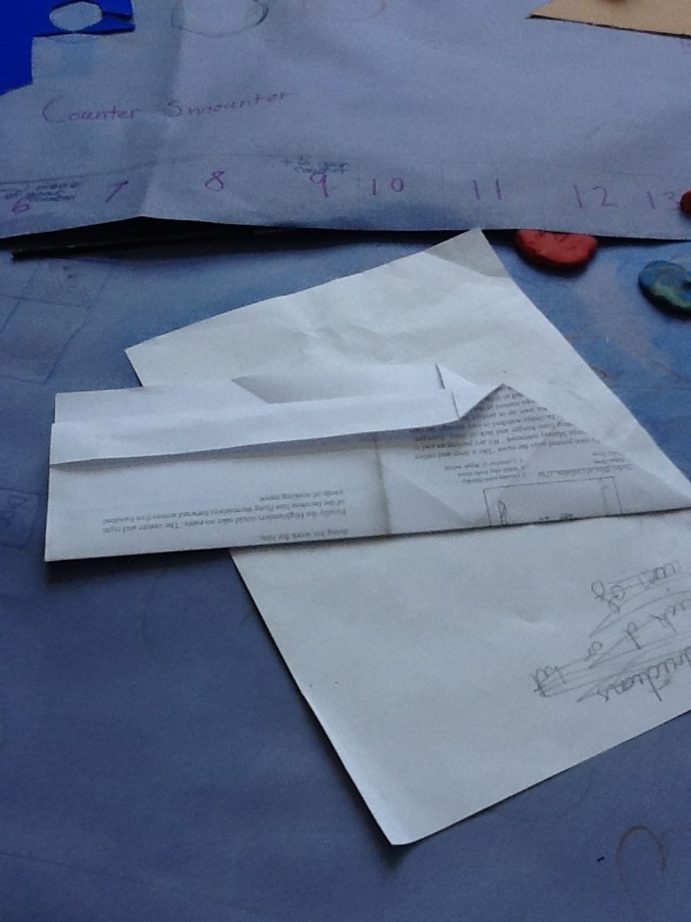 Now fold the top part of the aeroplane so that it will be able to fly strait. You can make them as big as you like