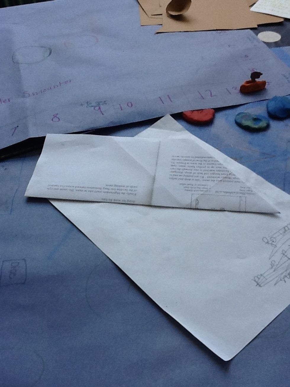 Now fold your piece of paper in half so that it looks like this