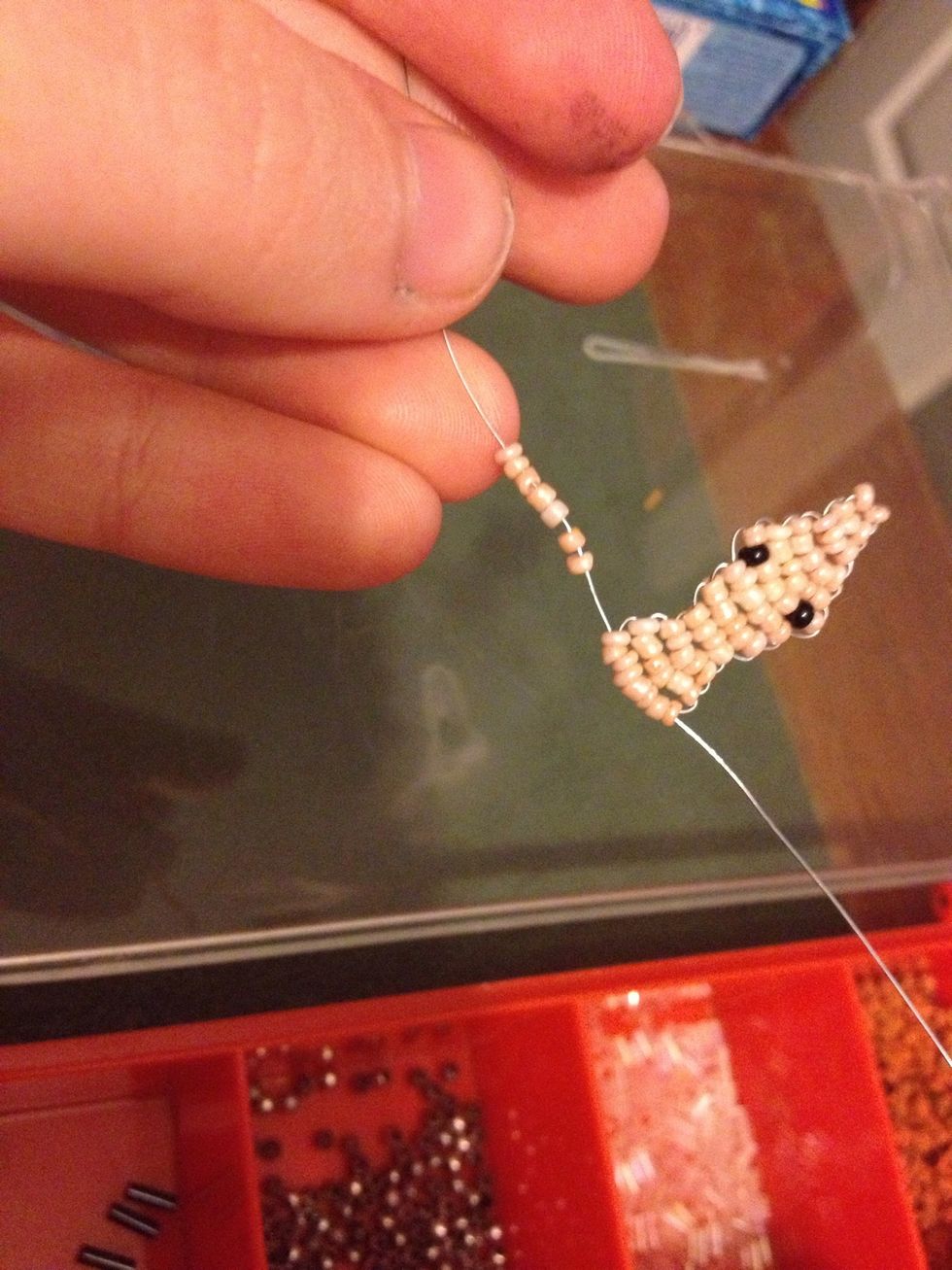 Now for arms .. Add 7 beads to one side