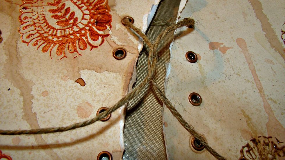 Now for lacing... start like lacing a shoe and twist once and then skip an eyelet and go in the next one. Then come back up and lace in the eyelet above and repeat the steps above.