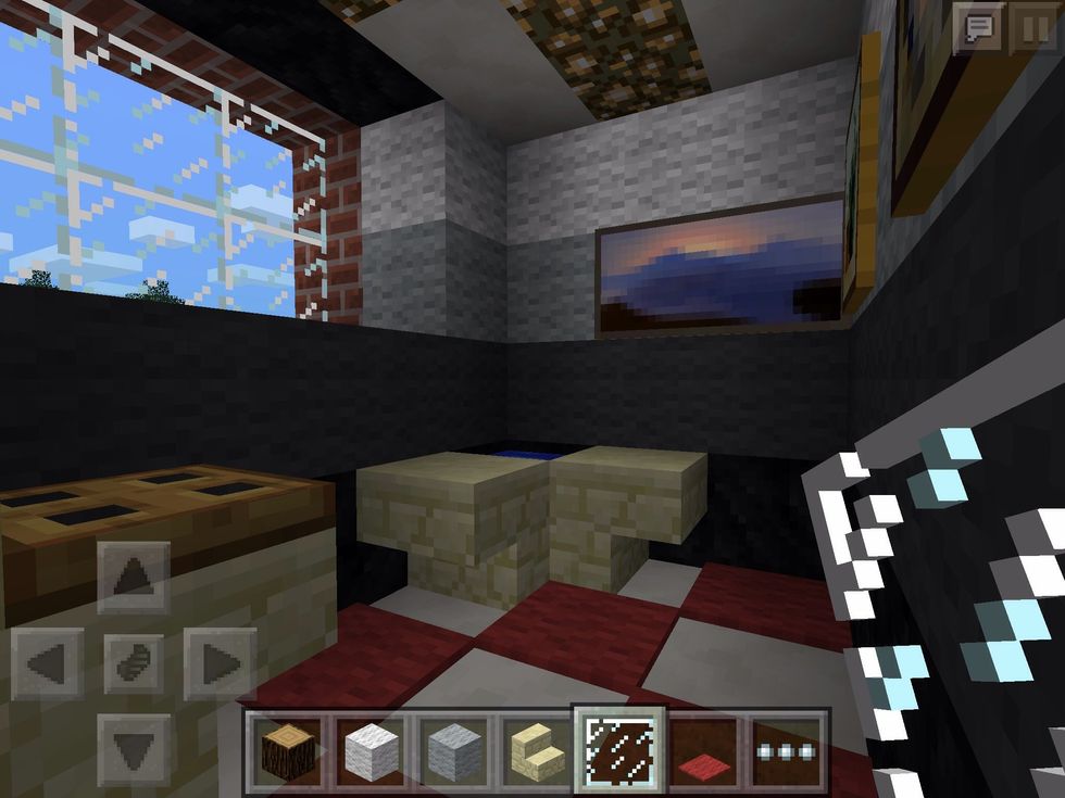 Now for some light! Add a quick window, and some glow stone in the ceiling to keep it warm and bright. Oh, and paintings too!