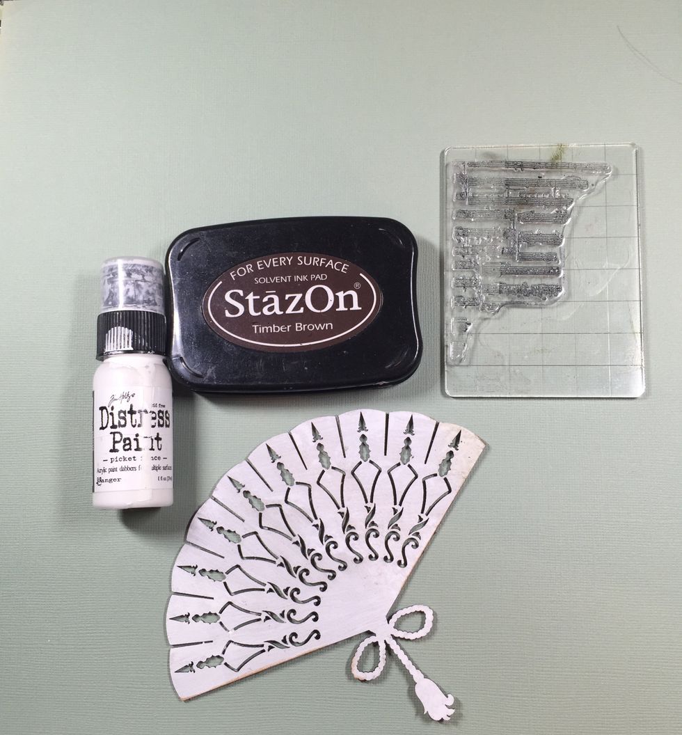 Now for that chipboard! It needs some treatment. First, it needs a white wash. You can use white paint or gesso. I've stamped with archival ink so it doesn't smudge because I plan to use some paint.