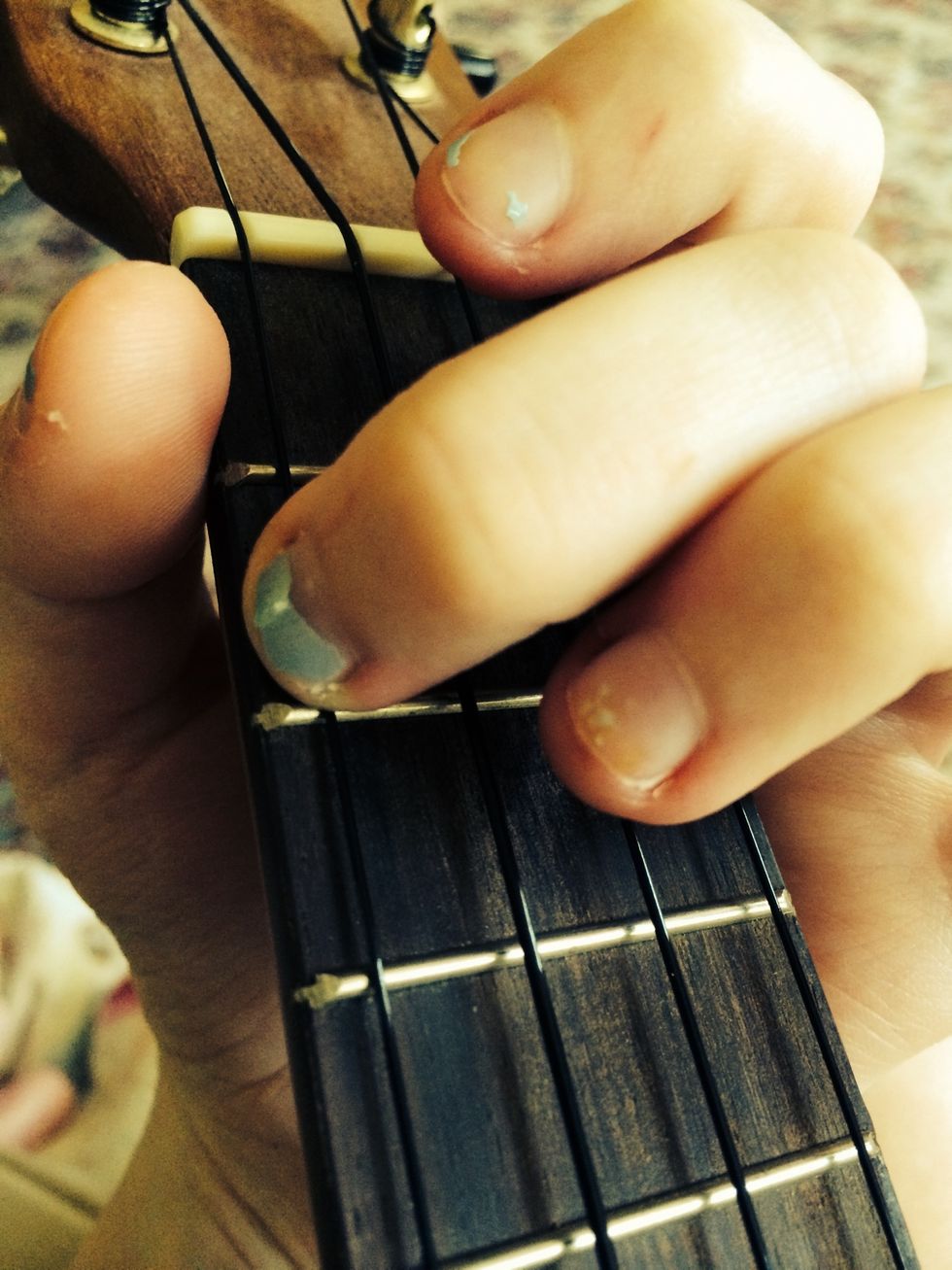 Now for the Am chord. Simply place your second finger on the 2nd fret of the G string.