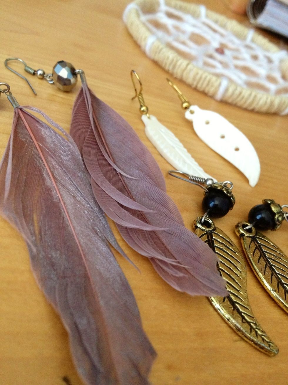 Now for the dangling decorations! I couldn't find any plain feathers, but I found a lot of old feather earrings that I don't wear anymore. These were my favorite to use on the dream catcher.