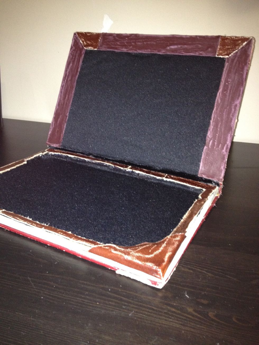 Now for the inside: after lining it with soft fabric, add leather trimming to the top and the bottom for a nice effect.