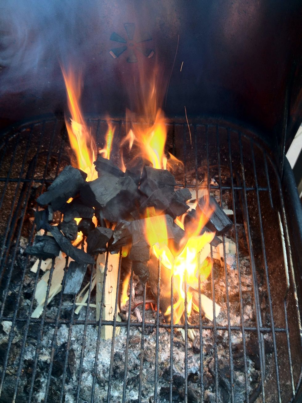 Now for the interesting part pot the charcoal on to of the fire this utilizes all the heat from the start getting the charcoal burning faster