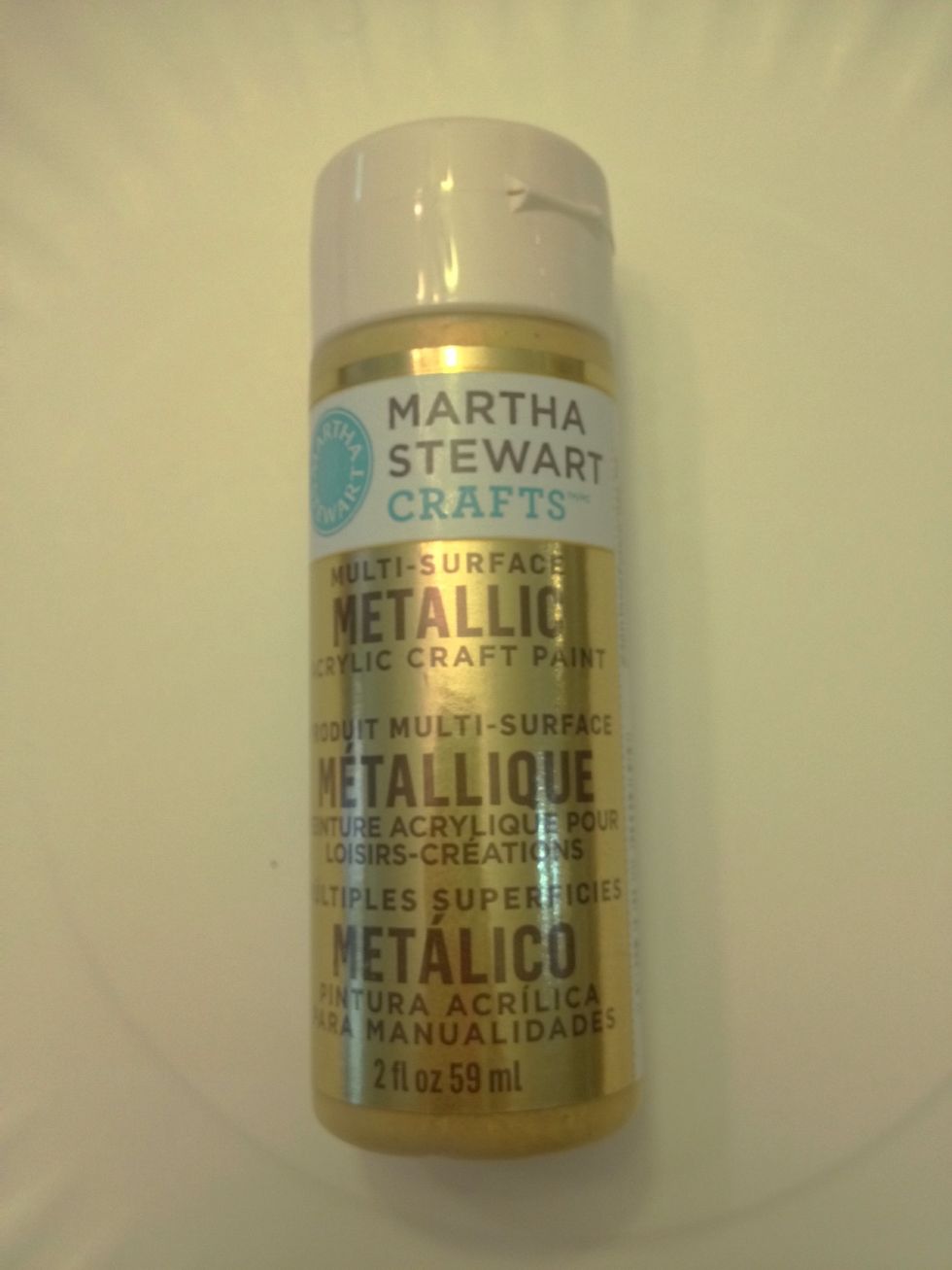 Now for the pop! Take your metallic craft paint (I used Martha Stewart's Yellow Gold Metallic Craft Paint) and with a foam brush...