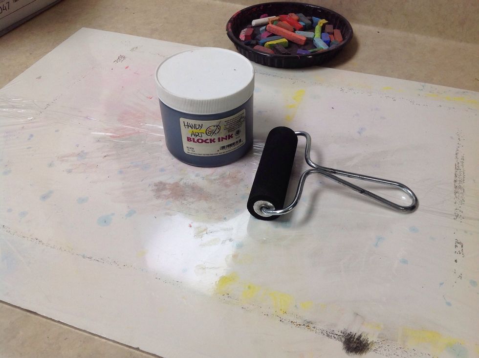 Now for the printing. I am using a smooth board wrapped in Saran Wrap. A laminated piece of construction paper or plastic placemat will also work.