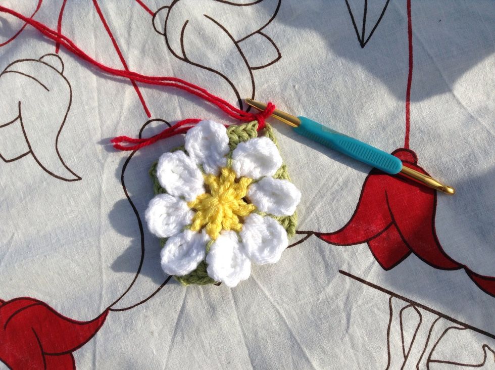 Now for your background colour. I chose red. :-) Join with a sl st to any of the corner spaces in the leaf part of your flower.