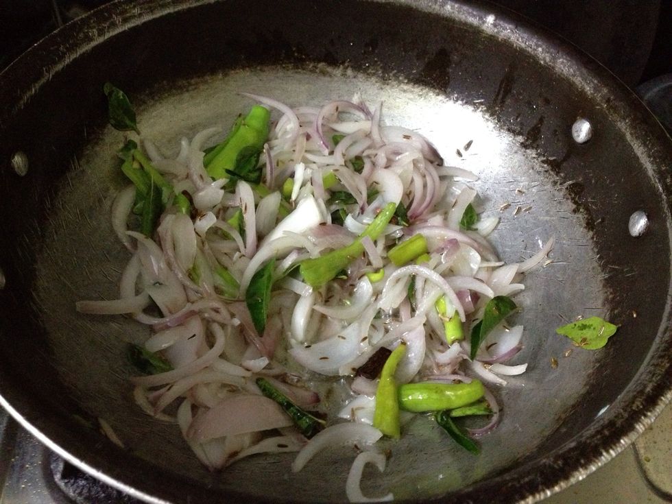 Now fry the onions, green chillies, curry leaves, cloves, cardamom, cumin seeds and Indian bay leaf ...