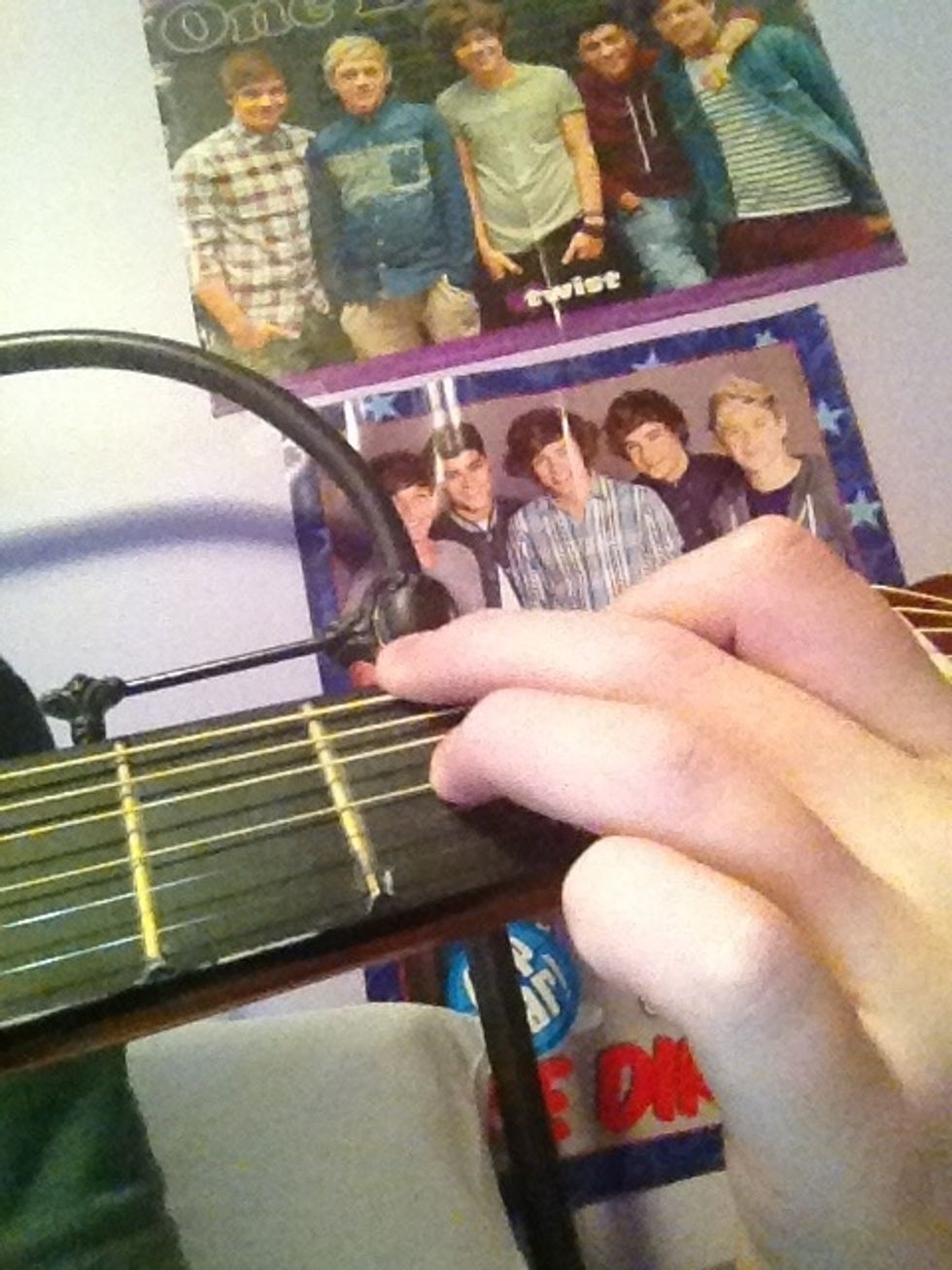 Now G (first finger: fifth string, second fret; second finger, sixth string, third fret; third finger: third string, third fret)