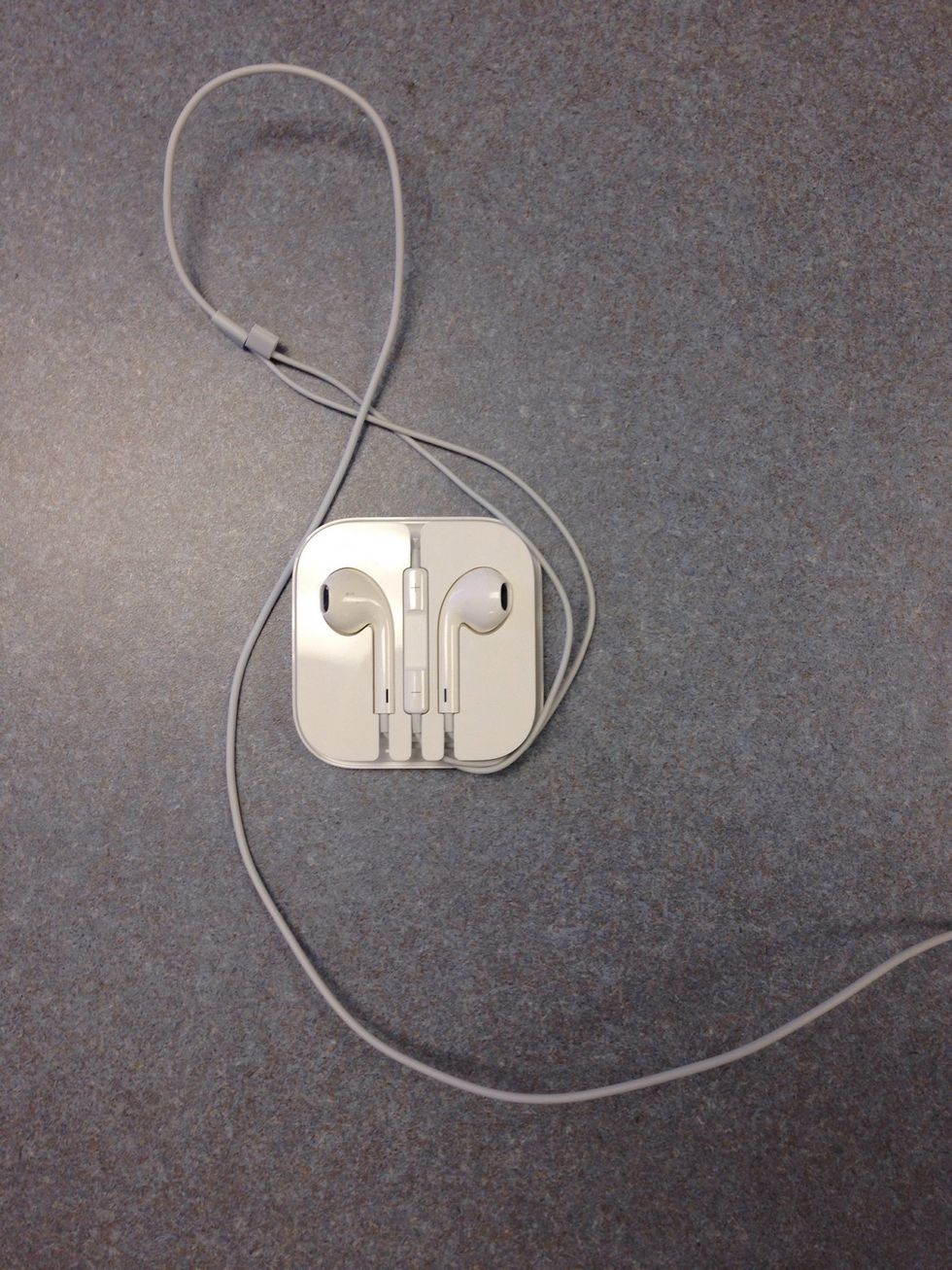 Now gather both cords and start wrapping from the bottom towards the right. Keep wrapping in a counter clockwise direction until the cord is fully wrapped around.  (Do not wrap the cord too loose.)