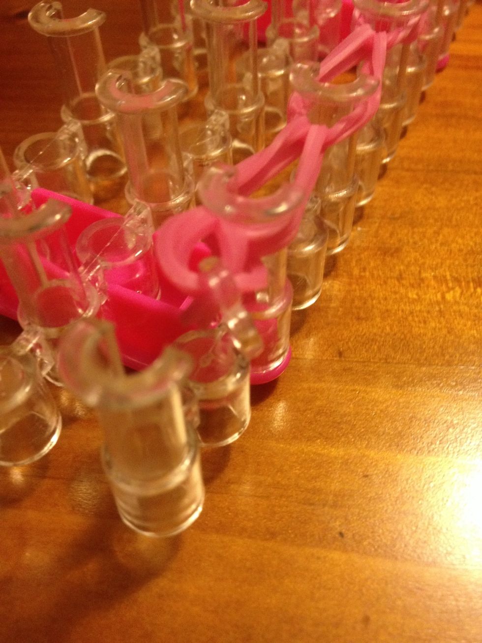 Now gently pull it up and off the loom toward the bracelet at other wnd