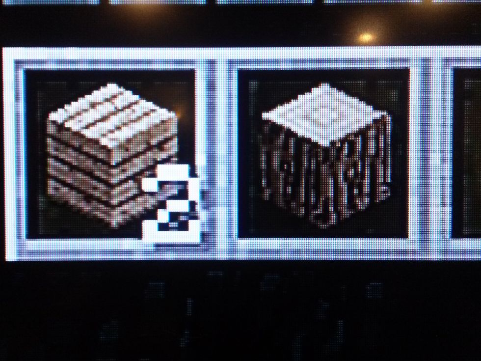 Now get 1 oak wood. Then grab the 2 oak wood planks from your inventory. You should now have 2 oak wood planks and 1 oak wood.