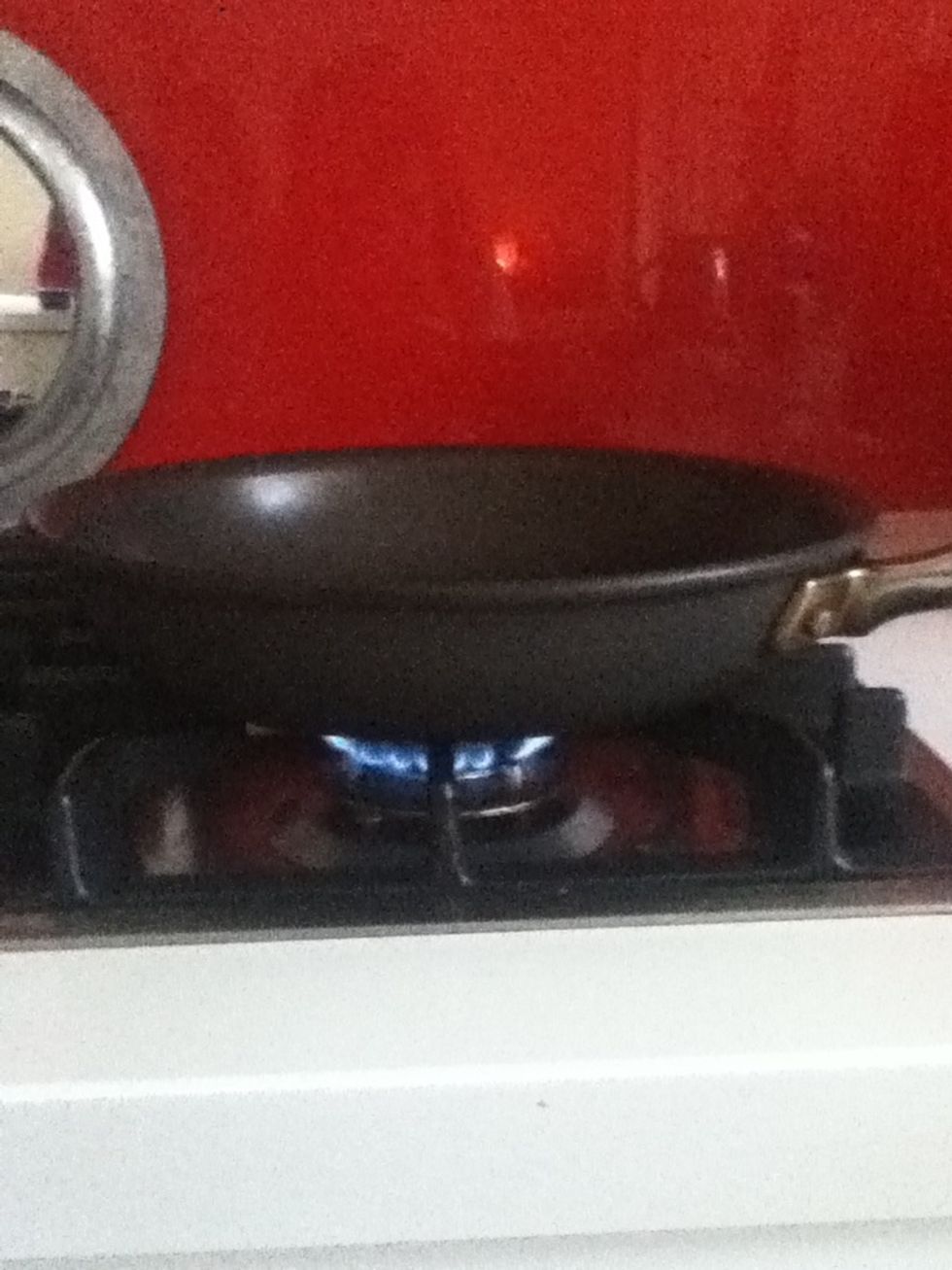 Now get a frying pan and put it on a stove on low heat