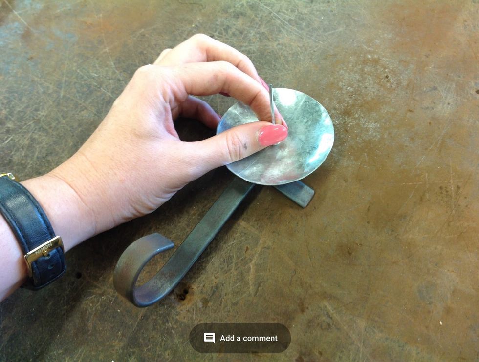 Now get a pot rivet and place it through the holes join your plate, scroll and foot together.