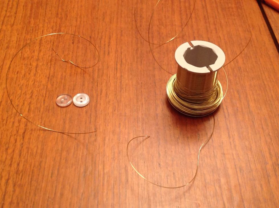 Now get about 6 inches of wire and a small button and thread the wire through the button. You need one of these for each SIDE of the star!