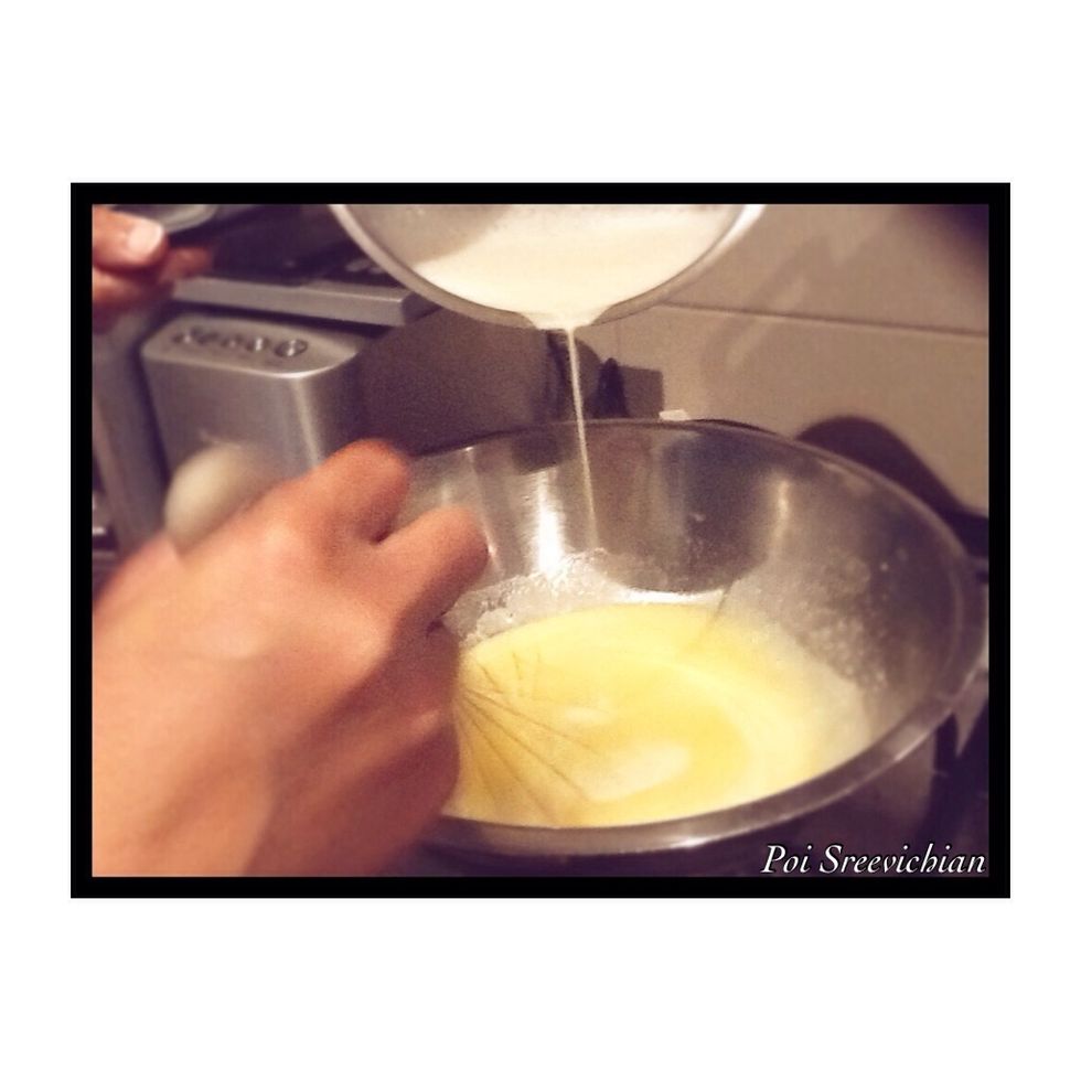 Now get milk and warm it up. When finished pour all of it into the egg and sugar mixture