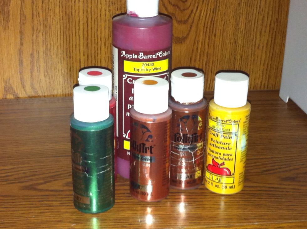 Now get out your paints and pour a small puddle of white paint and another color paint onto a paper plate. Add a little water.