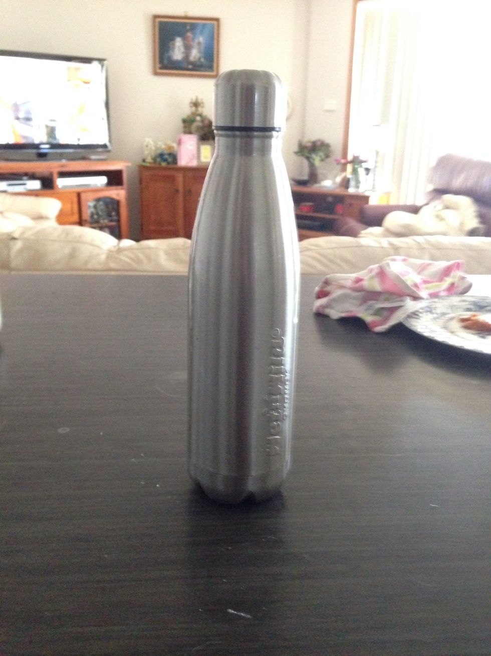 Now get the hot milk out of the microwave and pour it in the stainless steel bottle and shake (cover it with a tea towel or oven mitts cause it's hot)