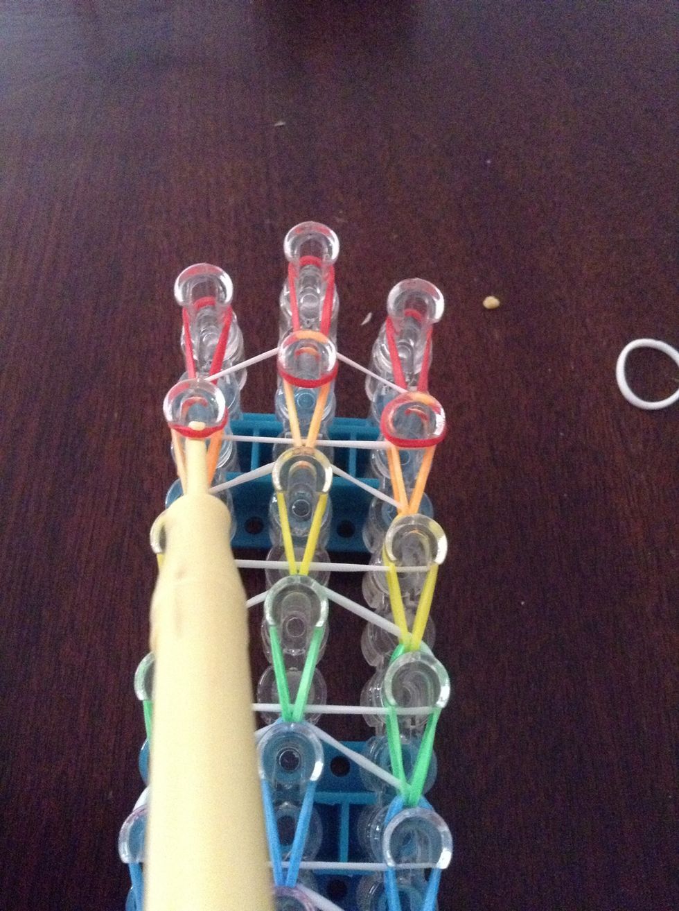 Now get the left red on the orange peg