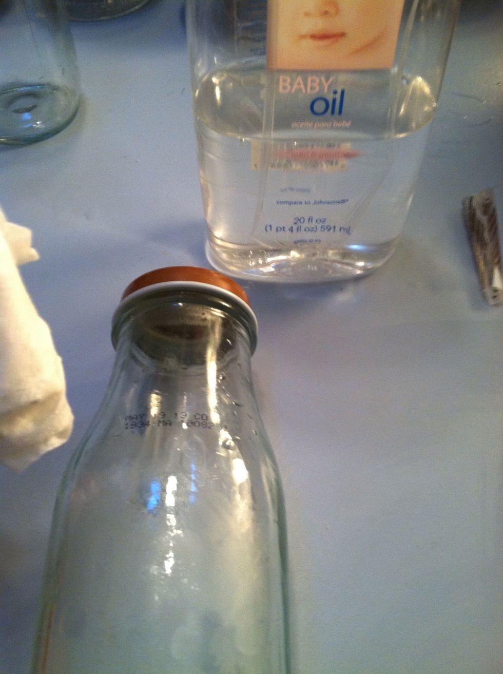 Now get your baby oil and put it on your napkin and scrub! It should come off easily I used tissue and it didn't even rip.