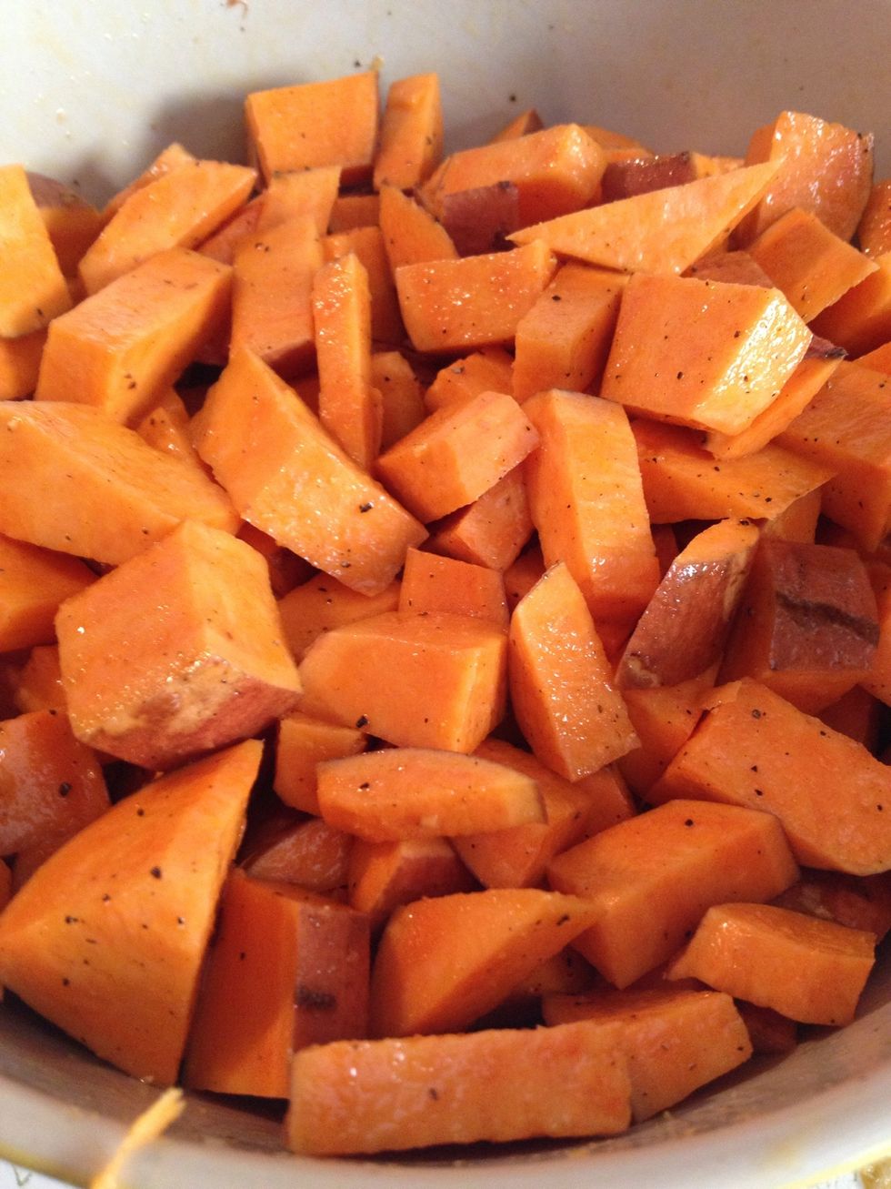 Now get your clean hands in there and toss and turn them. Make sure they're all coated. Here is where I added just a few shakes of Garlic Powder. Mix, mix, mix! Add more olive oil If needed.