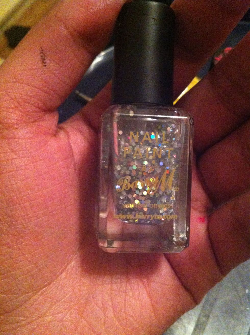 Now get your glitter nail varnish and apply as a top coat over your nails