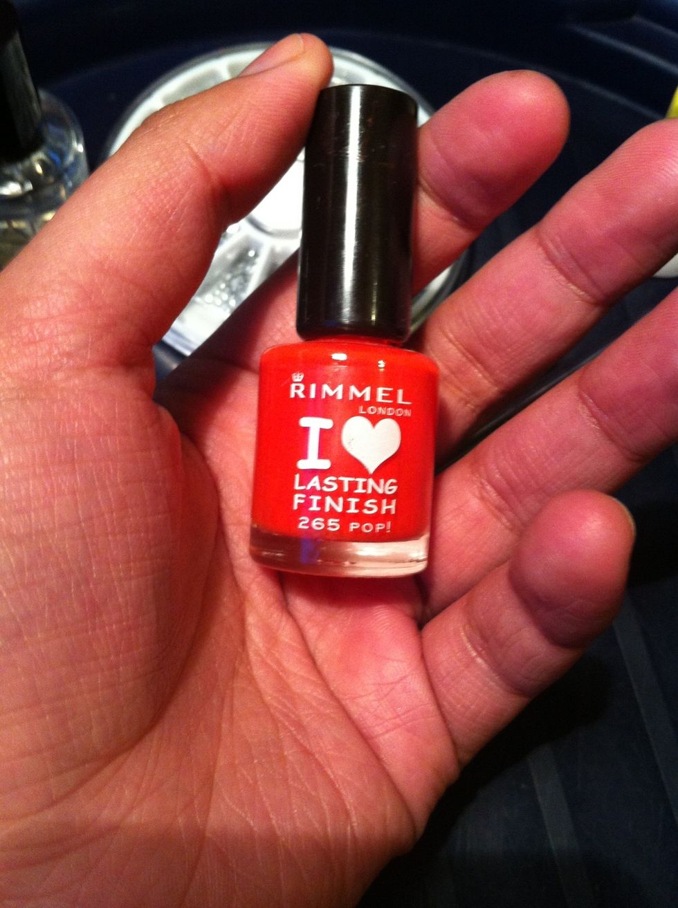 Now get your red nail varnish and paint all but one nail, I usually leave out my ring finger. This is so you can apply your glitter nail varnish if you have it if not carry on painting them all
