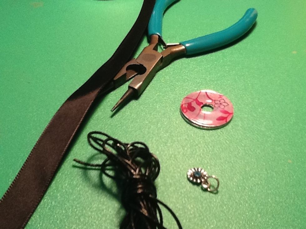 Now get your string,ribbon and charm (or bead)