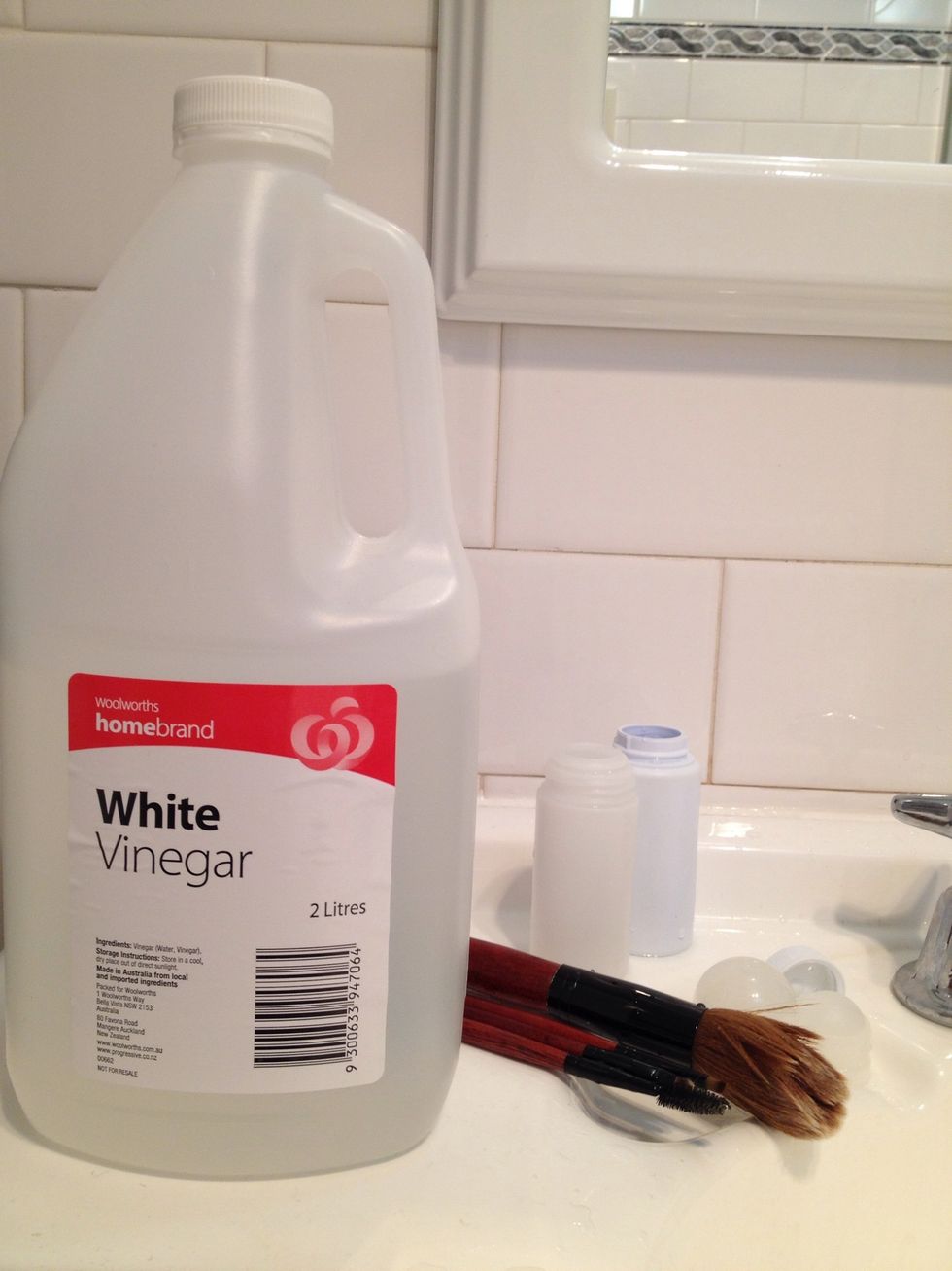 Now get your vinegar. The cheap white stuff will do just fine! Vinegar is an excellent disinfectant that won't harm your skin, is kind to the environment, and is a great softener for hair and fabric.