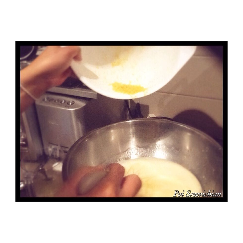 Now get your zest lemon and also put all of it into the egg and sugar mixture