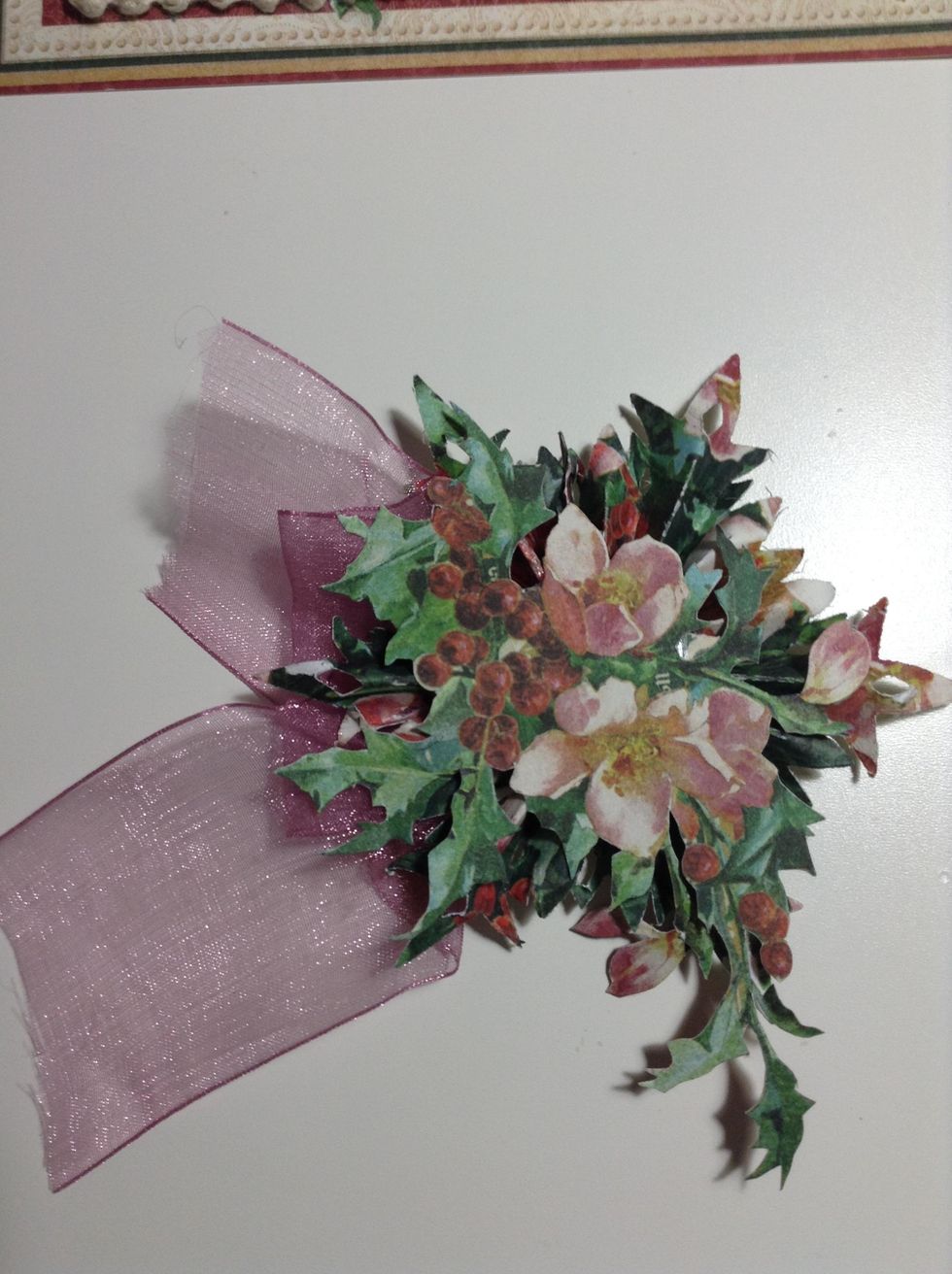 Now...glue a piece of ribbon (of your selection) under the snowflake.