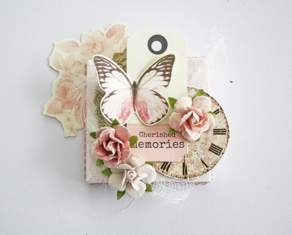 Now glue on 3 small flowers.