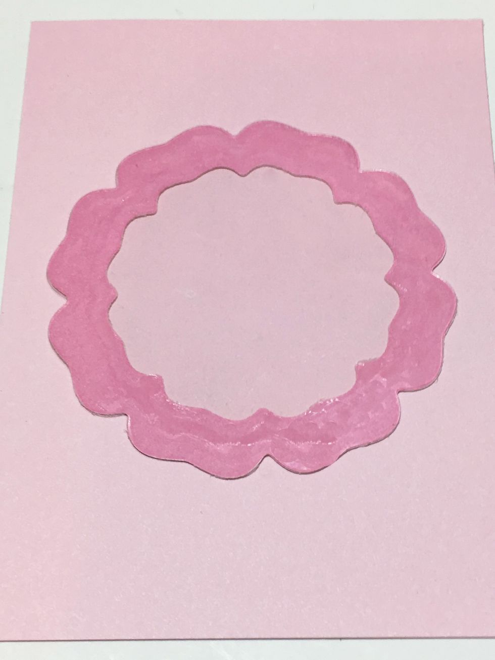 Now glue the piece of acetate to the frame. Be sure to spread the glue all over. You don't want any holes where your shakers can escape! I find a toothpick is a great tool for spreading the glue.