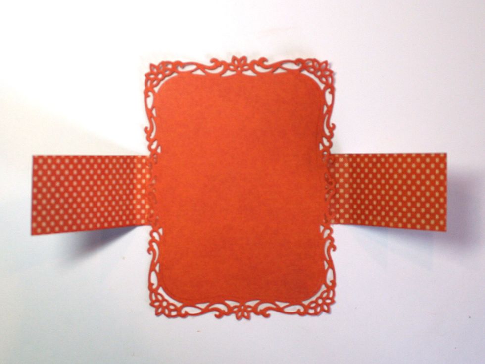 Now glue the short ends of the stamp strips to the back of the frame just beyond the scores. These will fold over and form a holder for your seed packet.