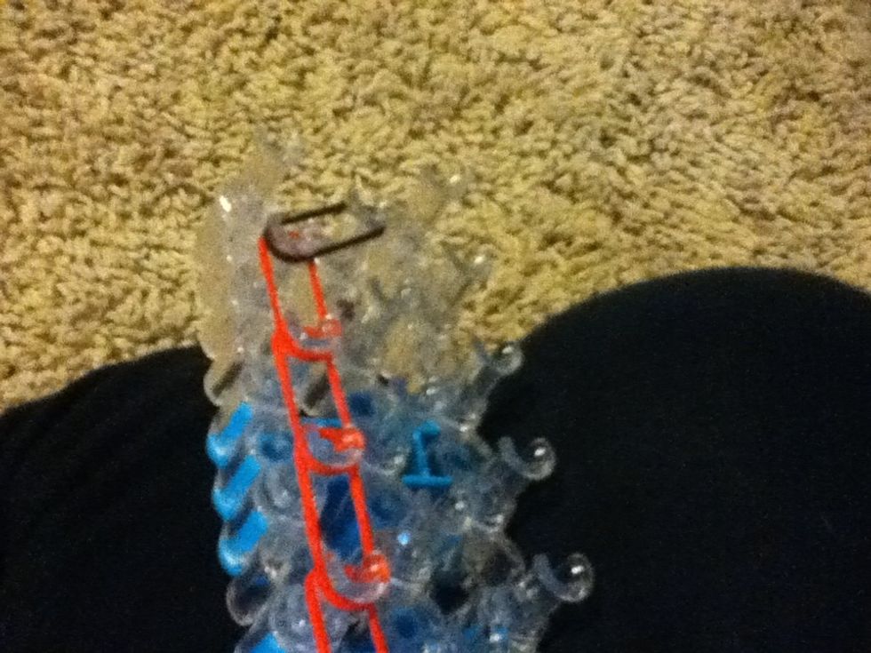 Now go all the way up and stop at the second last peg and point it like a pencil