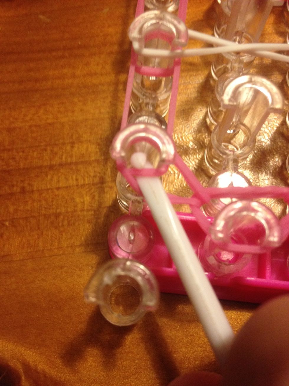 Now go Into the middle of the second left hand pin and grab the bottom band