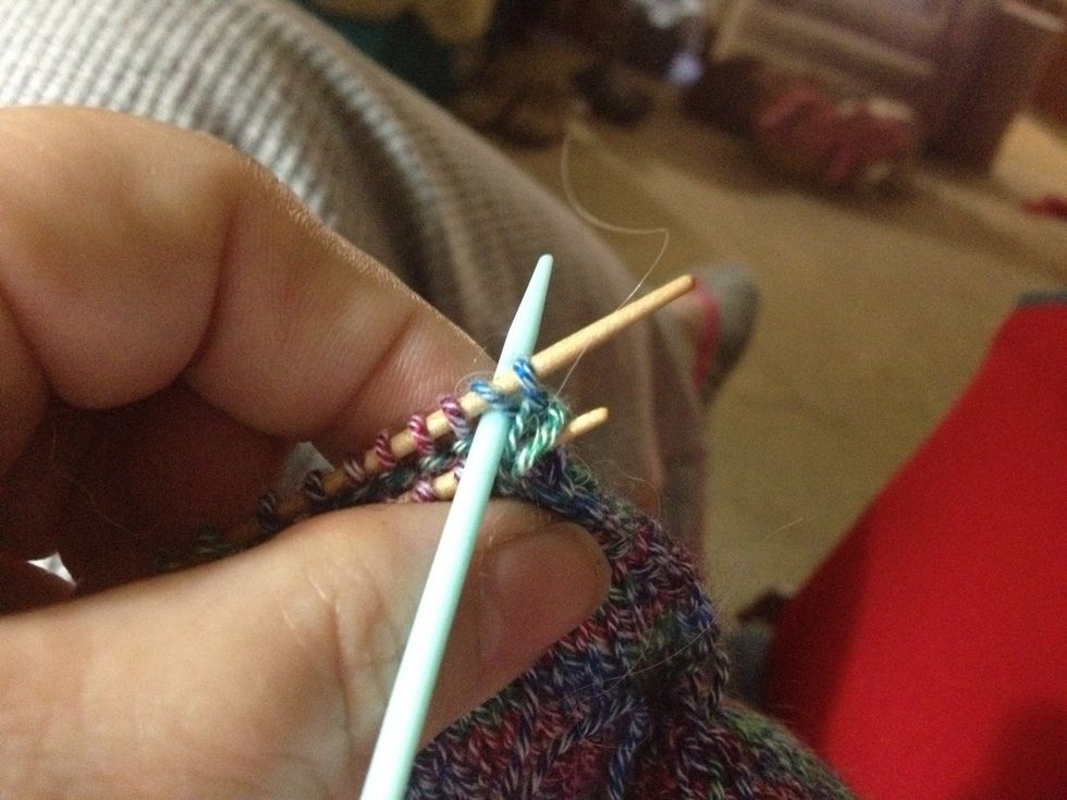 Now go knitwise through the 2nd stitch on the back needle. You can now slip the 1st stitch off the needle.