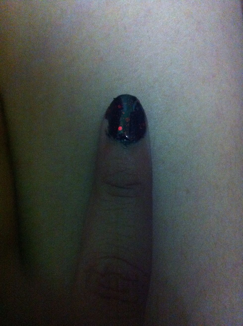 Now go over with the red sparkly nail piant