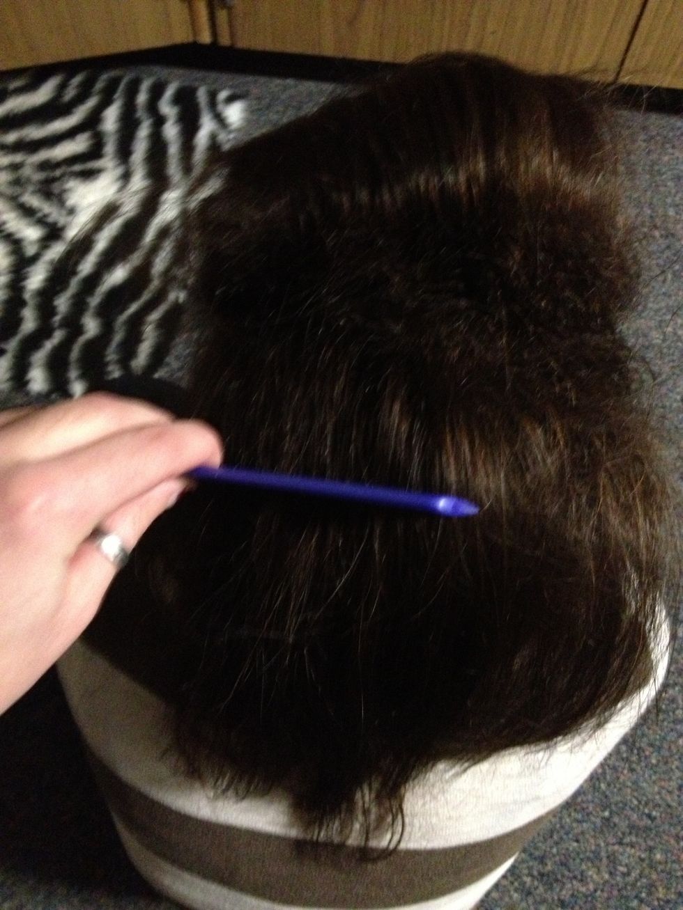 Now go through each layer laying them back down and gently combing them on the top.